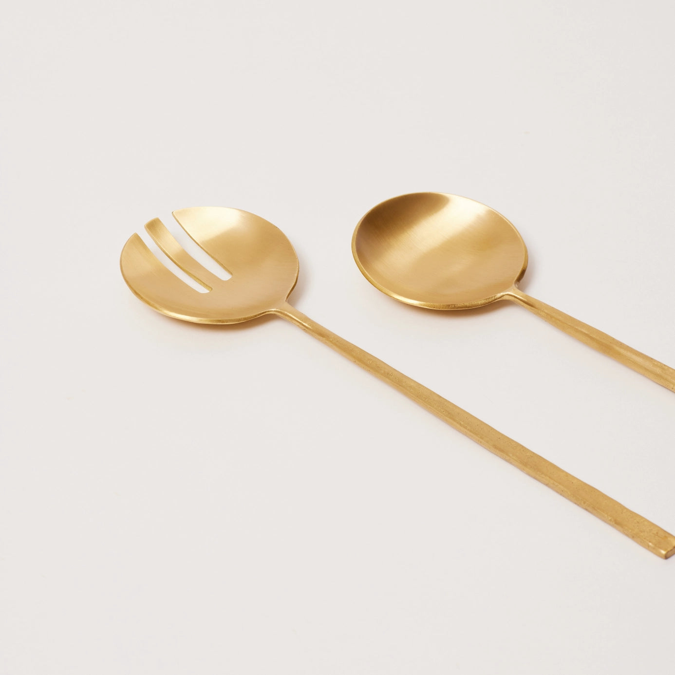 Modern brass serving utensils