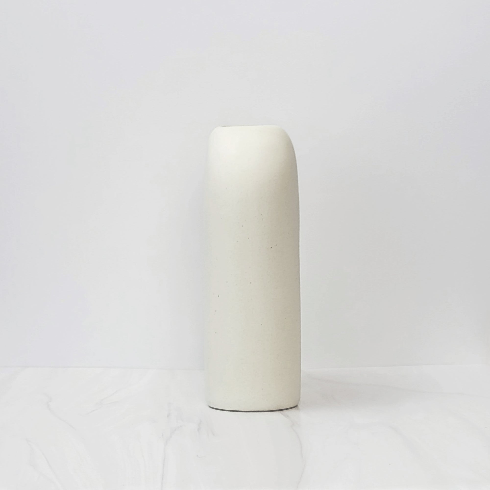 White U shaped Zo vase, side angle.
