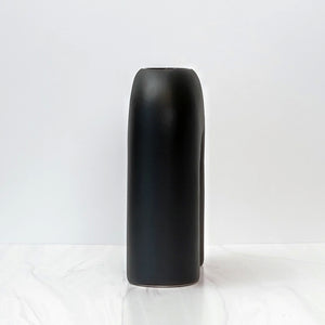 Black U shaped Zo vase, side angle.