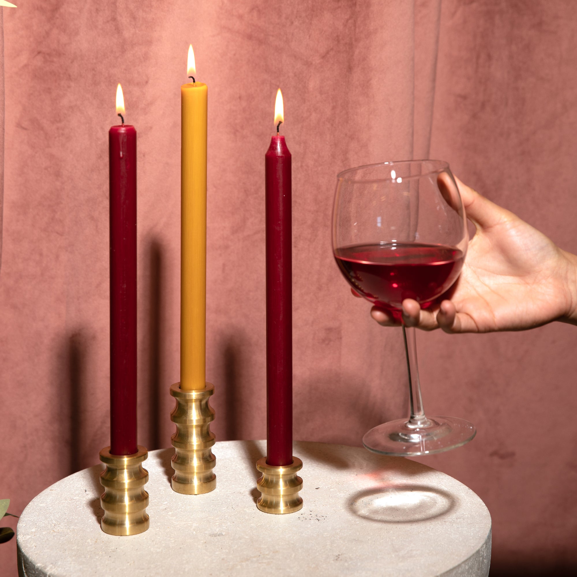 Sway candleholders with burgundy and harvest gold candles