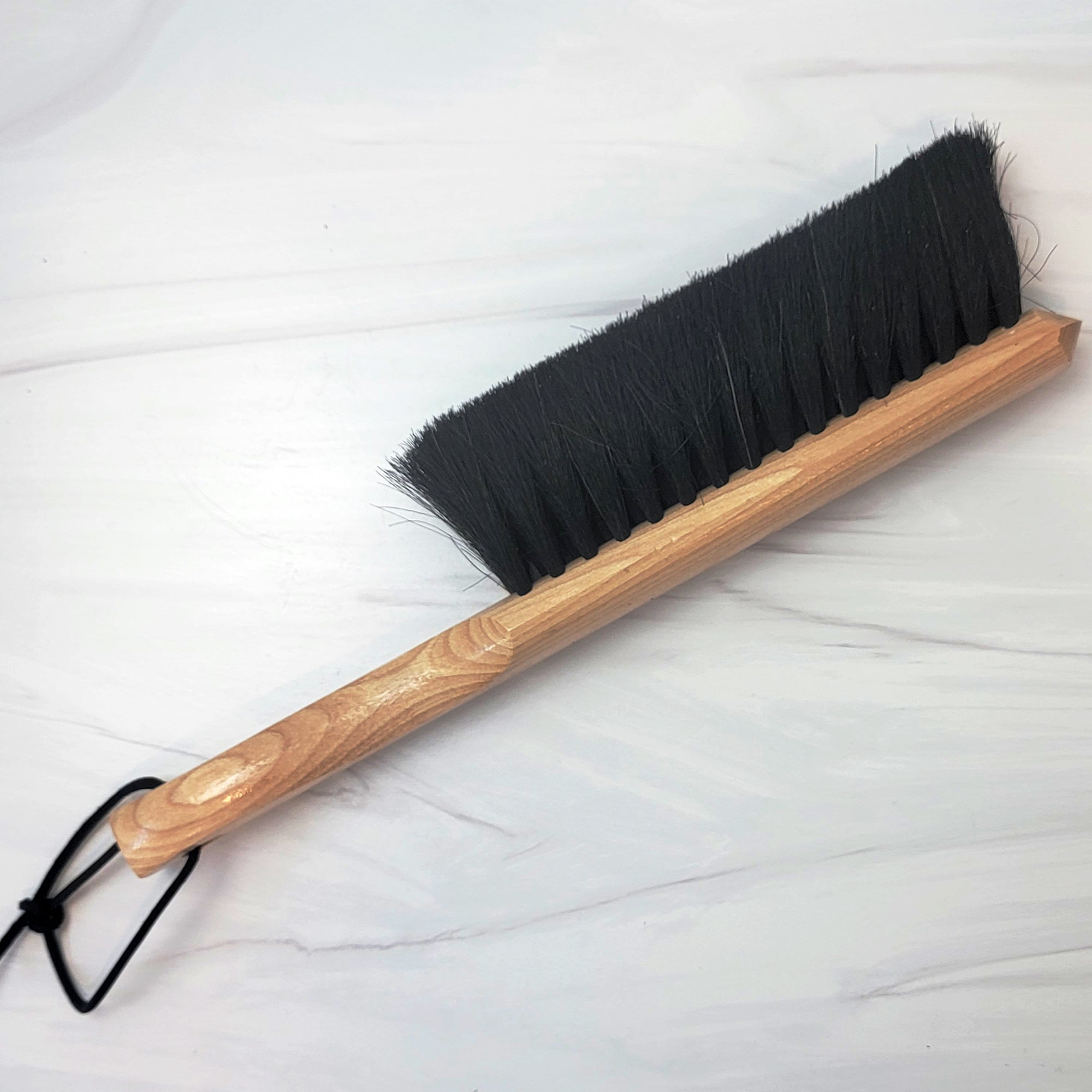 Horsehair and wood dust brush