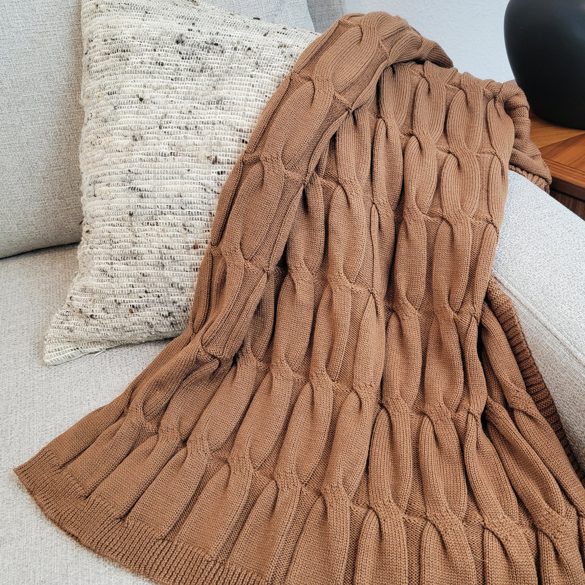 Grey Medellin pillow with Copper Bruce throw