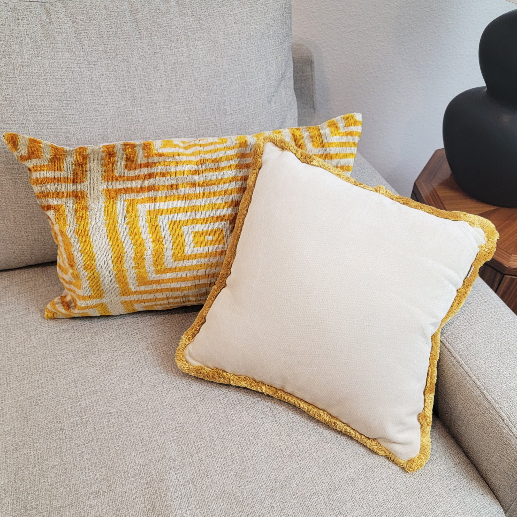 Golden geometric silk velvet ikat pillow with cream and gold fringe pillow
