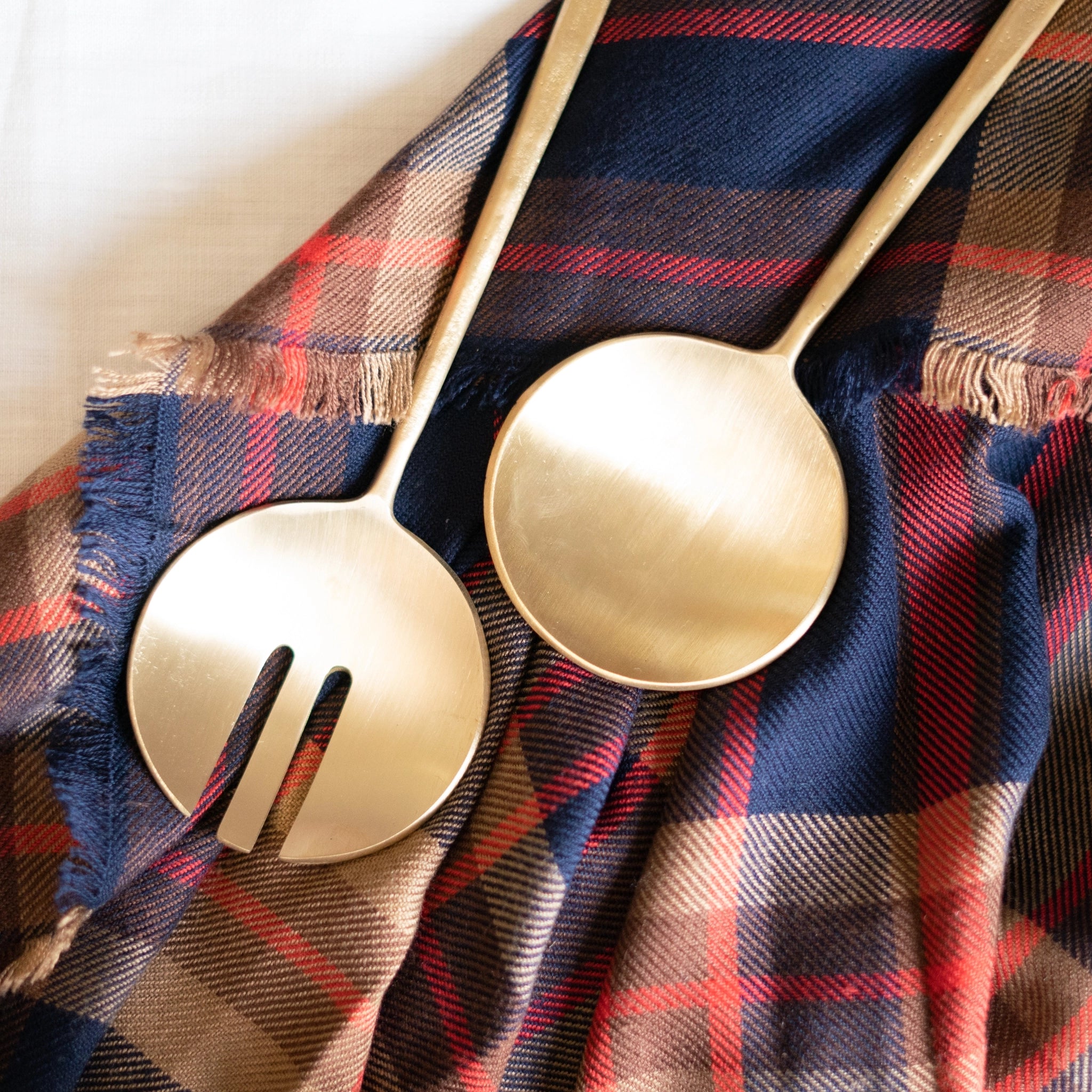 Modern brass serving utensils